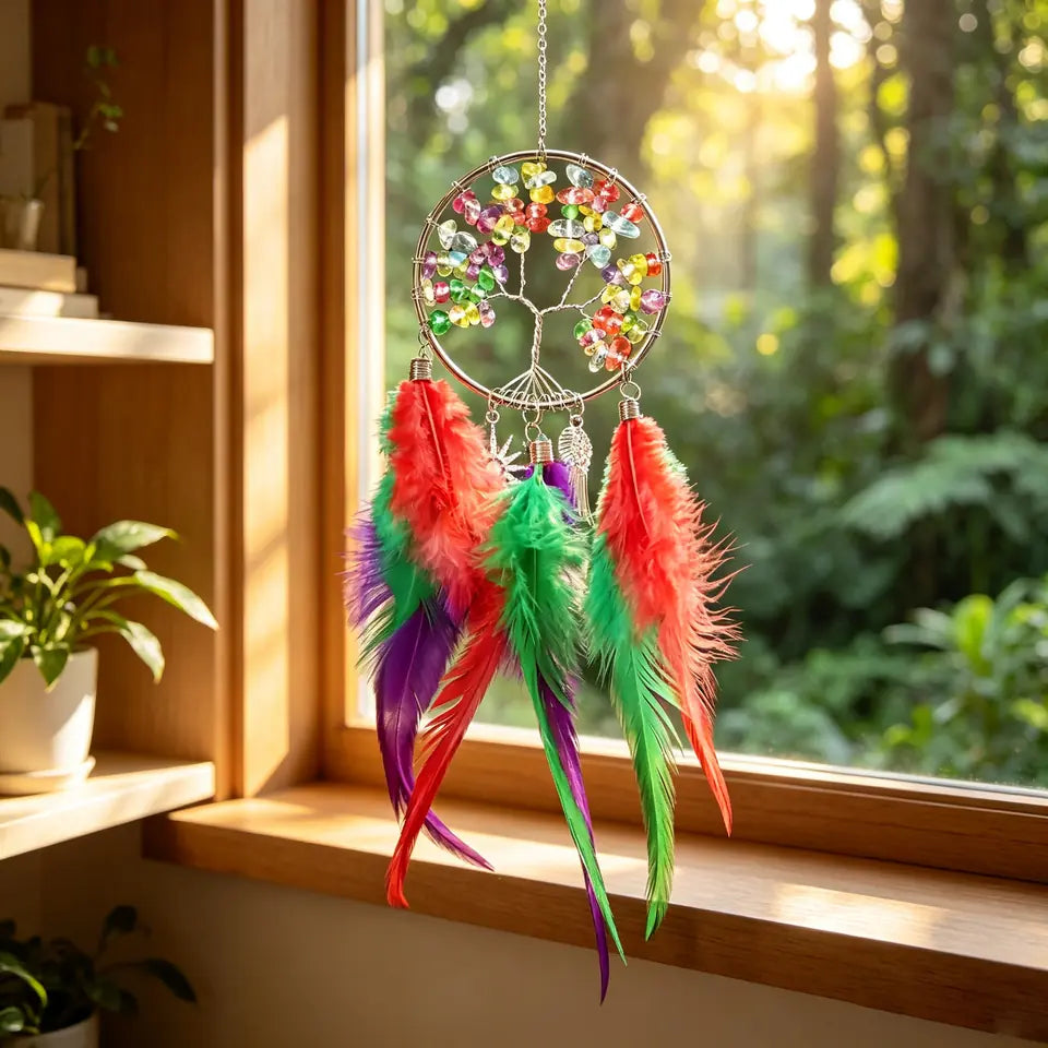 Colorful crystal Tree of Life feather hanging displayed in a warm room