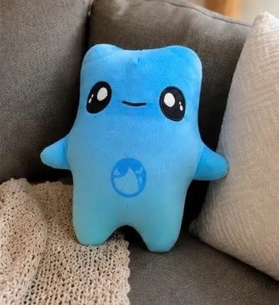 Puffi Water Sprite plush resting on a sofa