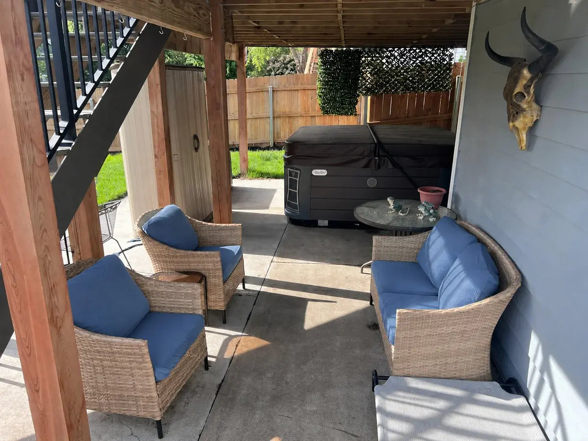 Real covered patio seating area with removable cushions